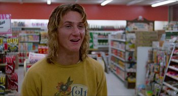 Movie still from “Fast Times at Ridgemont High” (1982), directed by Amy Heckerling – A man with long blonde hair standing in a grocery store; Close Up shot, Low angle