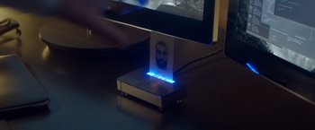 Movie still from “Ex Machina” (2014), directed by Alex Garland – A picture of a man on a computer screen; Extreme Close Up shot, High angle