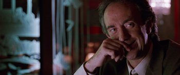 Movie still from “Glengarry Glen Ross” (1992), directed by James Foley – A person wearing a white shirt; Close Up shot, Over the shoulder angle