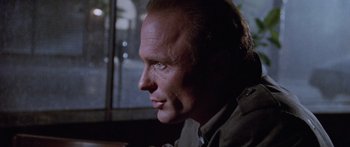 Movie still from “Glengarry Glen Ross” (1992), directed by James Foley – A person wearing a jacket; Close Up shot, Over the shoulder angle