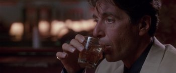Movie still from “Glengarry Glen Ross” (1992), directed by James Foley – A person drinking a glass of water; Close Up shot, Low angle