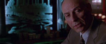 Movie still from “Glengarry Glen Ross” (1992), directed by James Foley – An older man sitting in front of a mirror; Close Up shot, Low angle