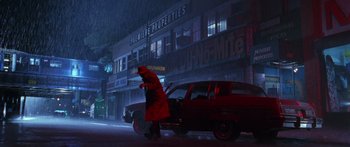 Movie still from “Glengarry Glen Ross” (1992), directed by James Foley – A man in a red raincoat walking on the street; Extreme Wide shot, Low angle