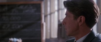 Movie still from “Glengarry Glen Ross” (1992), directed by James Foley – A person looking to his left; Close Up shot, Over the shoulder angle