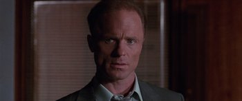 Movie still from “Glengarry Glen Ross” (1992), directed by James Foley – A man in a suit and tie; Close Up shot, Low angle