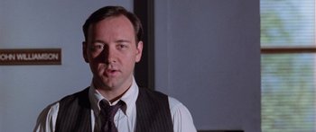 Movie still from “Glengarry Glen Ross” (1992), directed by James Foley – A person wearing a tie; Close Up shot, Low angle