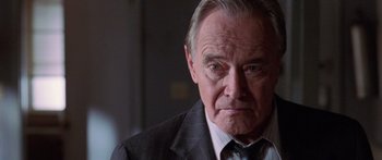 Movie still from “Glengarry Glen Ross” (1992), directed by James Foley – An older man wearing a suit and tie; Close Up shot, Low angle