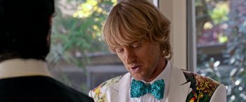 Movie still from “Father Figures” (2017), directed by Lawrence Sher – A person wearing a bow tie; Close Up shot, Over the shoulder angle
