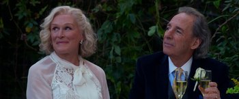 Movie still from “Father Figures” (2017), directed by Lawrence Sher – A man and a woman standing next to each other in front of trees; Close Up shot, Over the shoulder angle