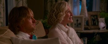 Movie still from “Father Figures” (2017), directed by Lawrence Sher – An older woman sitting next to a younger man; Close Up shot, Over the shoulder angle