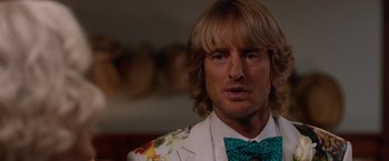 Movie still from “Father Figures” (2017), directed by Lawrence Sher – A person wearing a suit and a bow tie; Close Up shot, Over the shoulder angle