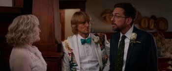 Movie still from “Father Figures” (2017), directed by Lawrence Sher – A man in a suit and tie next to another man in a suit and tie; Medium shot, Over the shoulder angle