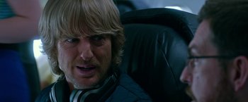 Movie still from “Father Figures” (2017), directed by Lawrence Sher – A person sitting in a chair; Close Up shot, Over the shoulder angle