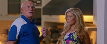 Movie still from “Father Figures” (2017), directed by Lawrence Sher – A man and a woman standing next to each other; Medium shot, Over the shoulder angle