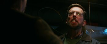 Movie still from “Father Figures” (2017), directed by Lawrence Sher – A person wearing glasses; Close Up shot, Low angle