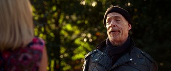 Movie still from “Father Figures” (2017), directed by Lawrence Sher – An older man wearing a black leather jacket and a black hat; Close Up shot, Low angle
