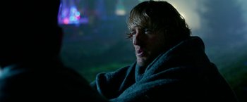 Movie still from “Father Figures” (2017), directed by Lawrence Sher – A person wearing a blanket; Close Up shot, Over the shoulder angle