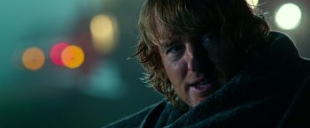 Movie still from “Father Figures” (2017), directed by Lawrence Sher – A man's face in a dark room; Close Up shot, Over the shoulder angle