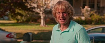Movie still from “Father Figures” (2017), directed by Lawrence Sher – A person wearing a blue shirt; Close Up shot, Over the shoulder angle
