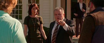 Movie still from “Father Figures” (2017), directed by Lawrence Sher – A man and a woman standing next to each other outside; Medium shot, Over the shoulder angle