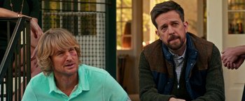 Movie still from “Father Figures” (2017), directed by Lawrence Sher – Two men sitting next to each other in a room; Close Up shot, Over the shoulder angle