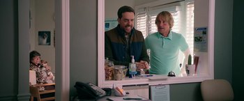 Movie still from “Father Figures” (2017), directed by Lawrence Sher – Two men are standing in front of a bathroom mirror; Medium shot, Over the shoulder angle