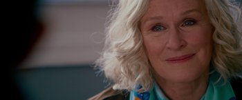 Movie still from “Father Figures” (2017), directed by Lawrence Sher – A person wearing a scarf; Close Up shot, Over the shoulder angle