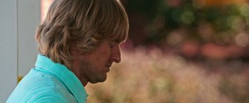 Movie still from “Father Figures” (2017), directed by Lawrence Sher – A person's face in a field; Close Up shot, Low angle