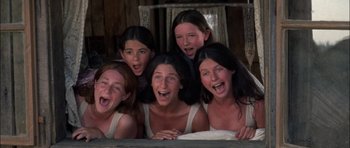 Movie still from “Fiddler on the Roof” (1971), directed by Norman Jewison – A group of women are posing for a picture; Medium shot, High angle