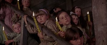Movie still from “Fiddler on the Roof” (1971), directed by Norman Jewison – A group of children holding candles in a barn; Close Up shot, High angle