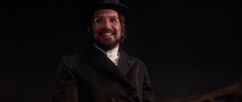 Movie still from “Fiddler on the Roof” (1971), directed by Norman Jewison – A man in a top hat and a suit; Close Up shot, Low angle