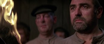 Movie still from “Fiddler on the Roof” (1971), directed by Norman Jewison – A man in a military uniform looking at a camera; Close Up shot, Low angle