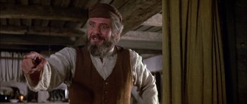 Movie still from “Fiddler on the Roof” (1971), directed by Norman Jewison – An older man with a beard and a hat; Close Up shot, Low angle
