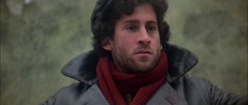 Movie still from “Fiddler on the Roof” (1971), directed by Norman Jewison – A person wearing a coat and a scarf; Close Up shot, Low angle