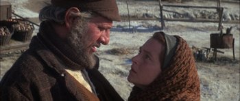 Movie still from “Fiddler on the Roof” (1971), directed by Norman Jewison – An older man and a younger woman looking at each other; Close Up shot, Over the shoulder angle