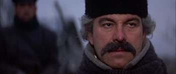 Movie still from “Fiddler on the Roof” (1971), directed by Norman Jewison – A person with a mustache wearing a hat; Close Up shot, Low angle