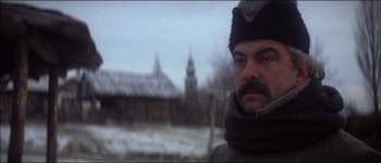 Movie still from “Fiddler on the Roof” (1971), directed by Norman Jewison – A person wearing a hat and a scarf; Close Up shot, Low angle