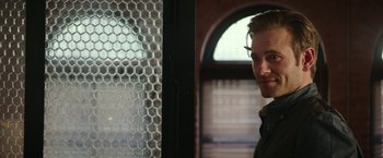 Movie still from “Fifty Shades Darker” (2017), directed by James Foley – A man standing in front of a window; Close Up shot, Over the shoulder angle