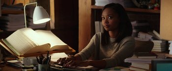 Movie still from “Fifty Shades Darker” (2017), directed by James Foley – A woman sitting in front of a computer keyboard; Medium shot, Over the shoulder angle