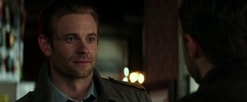 Movie still from “Fifty Shades Darker” (2017), directed by James Foley – A person wearing a jacket; Close Up shot, Over the shoulder angle