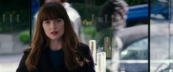 Movie still from “Fifty Shades Darker” (2017), directed by James Foley – A person with long brown hair; Close Up shot, Over the shoulder angle