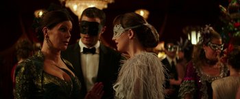 Movie still from “Fifty Shades Darker” (2017), directed by James Foley – A man and a woman wearing a mask and feathers; Close Up shot, Over the shoulder angle