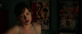 Movie still from “Fifty Shades Darker” (2017), directed by James Foley – A person wearing a red lipstick; Close Up shot, Over the shoulder angle