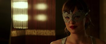 Movie still from “Fifty Shades Darker” (2017), directed by James Foley – A person wearing a mask; Close Up shot, Over the shoulder angle
