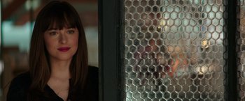 Movie still from “Fifty Shades Darker” (2017), directed by James Foley – A person looking out a window; Close Up shot, Over the shoulder angle