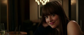 Movie still from “Fifty Shades Darker” (2017), directed by James Foley – A person with long brown hair; Close Up shot, Over the shoulder angle
