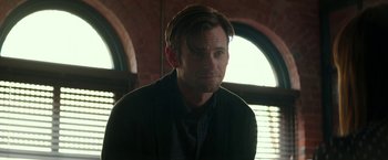 Movie still from “Fifty Shades Darker” (2017), directed by James Foley – A person wearing a suit and tie; Close Up shot, Over the shoulder angle