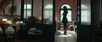 Movie still from “Fifty Shades Darker” (2017), directed by James Foley – A woman standing in front of an open window; Wide shot, Over the shoulder angle