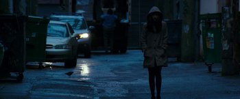 Movie still from “Fifty Shades Darker” (2017), directed by James Foley – A woman is standing on the side of the street; Wide shot, Over the shoulder angle