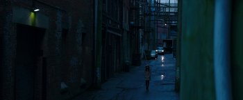Movie still from “Fifty Shades Darker” (2017), directed by James Foley – A woman walking down a street at night; Extreme Wide shot, High angle